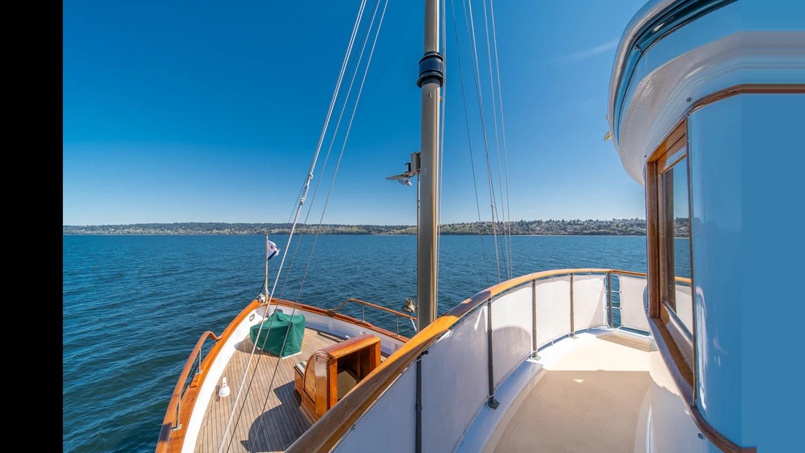 The aft deck offers a serene space with a beautiful view of the water and surrounding landscape. aboard BLUE PETER Yacht for Sale