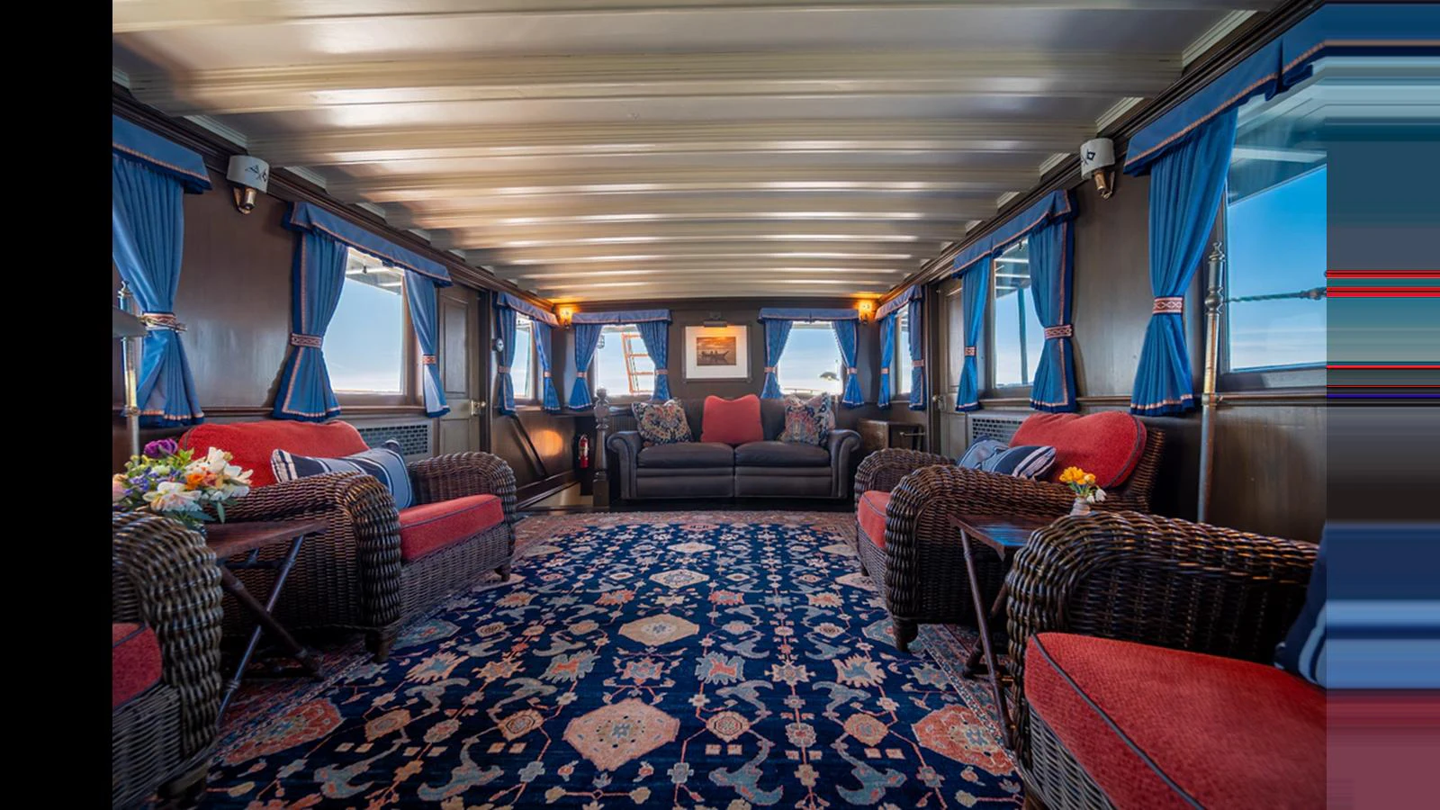 The yacht's salon features a cozy and inviting seating area with plush sofas and elegant decor. aboard BLUE PETER Yacht for Sale
