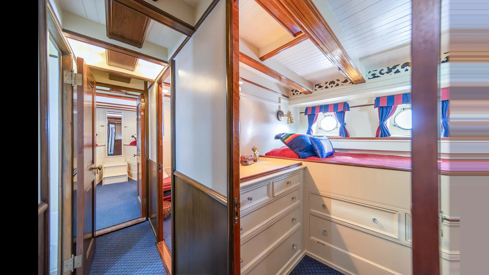 A cozy cabin with nautical decor and ample storage space. aboard BLUE PETER Yacht for Sale