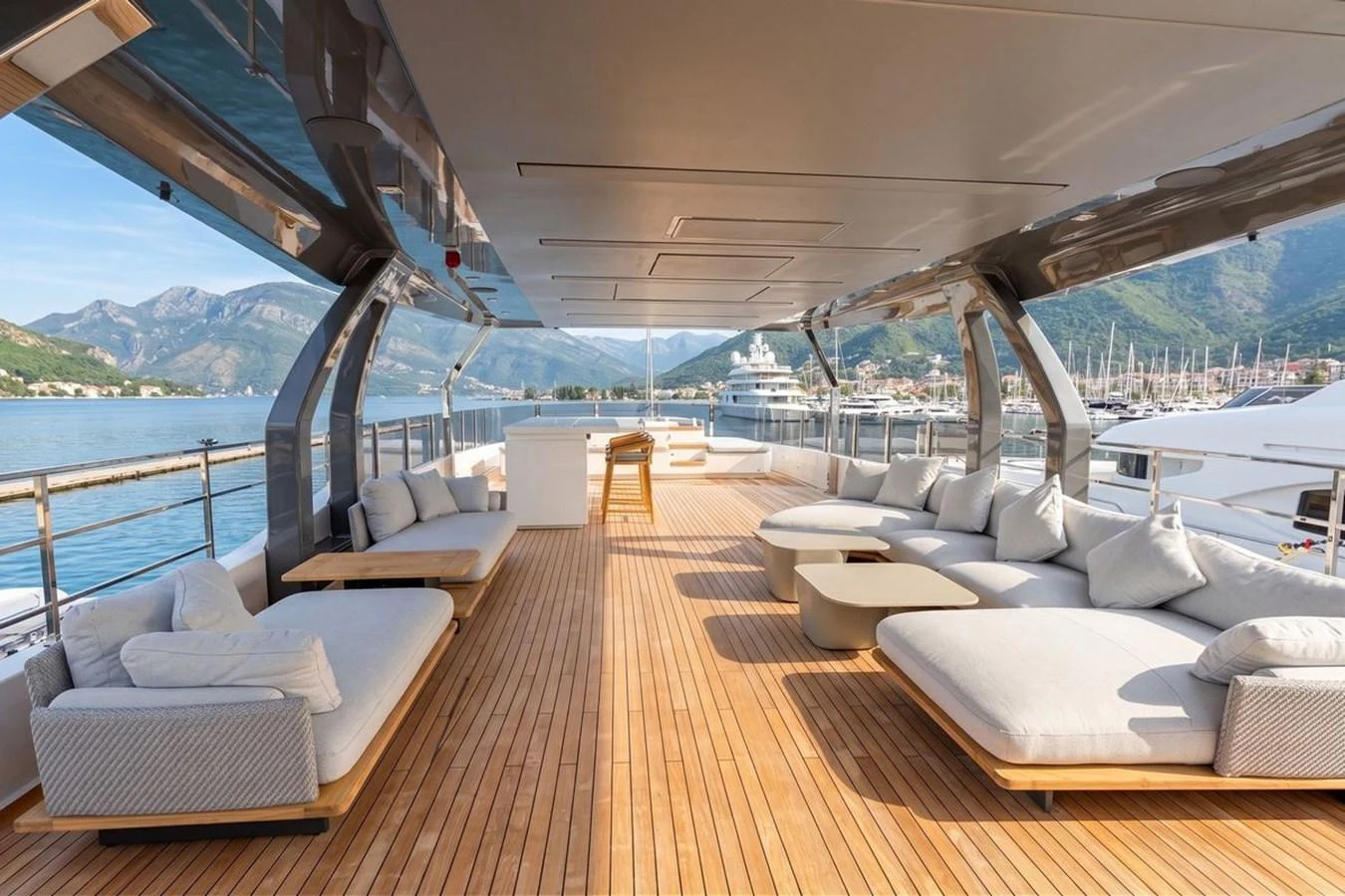 The aft deck offers a spacious and luxurious lounging area with stunning views of the marina. aboard ALBUS Yacht for Sale