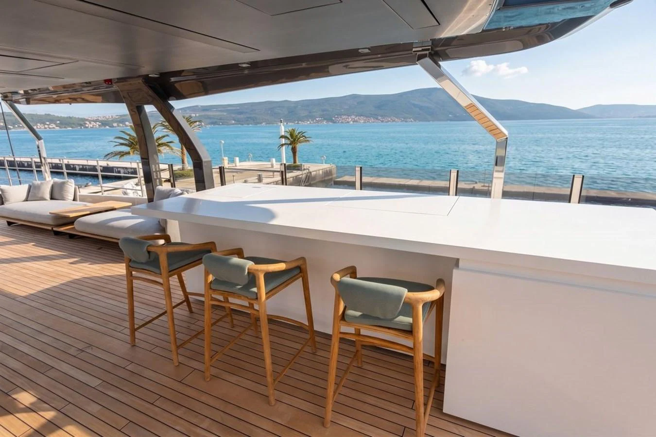The yacht features a stylish outdoor bar with a scenic ocean view. aboard ALBUS Yacht for Sale