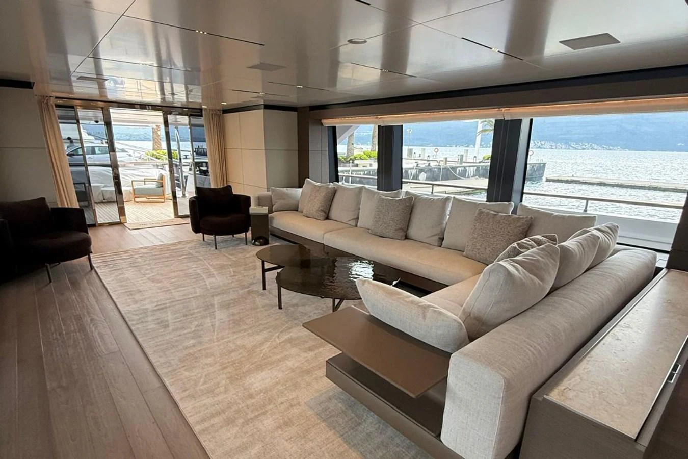 The spacious salon offers a luxurious and comfortable seating area with panoramic views. aboard ALBUS Yacht for Sale