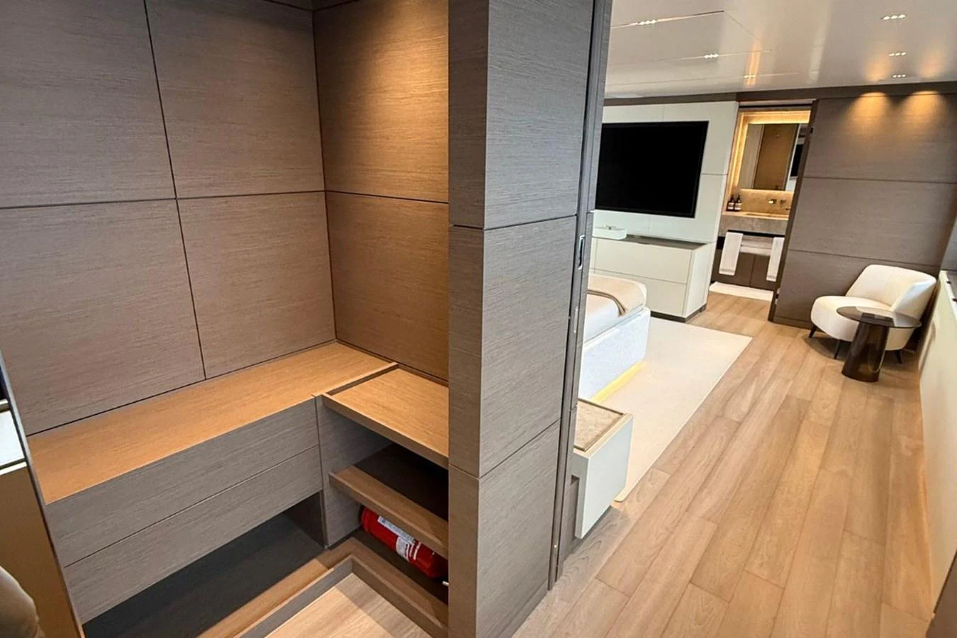 The yacht's interior features a modern design with sleek wood paneling and a spacious layout. aboard ALBUS Yacht for Sale