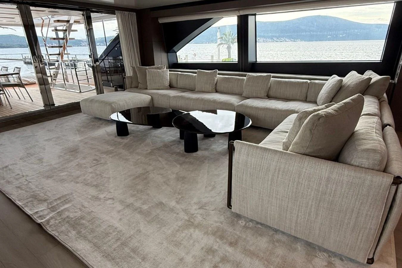 The salon features a spacious and elegant seating area with panoramic views of the water. aboard ALBUS Yacht for Sale
