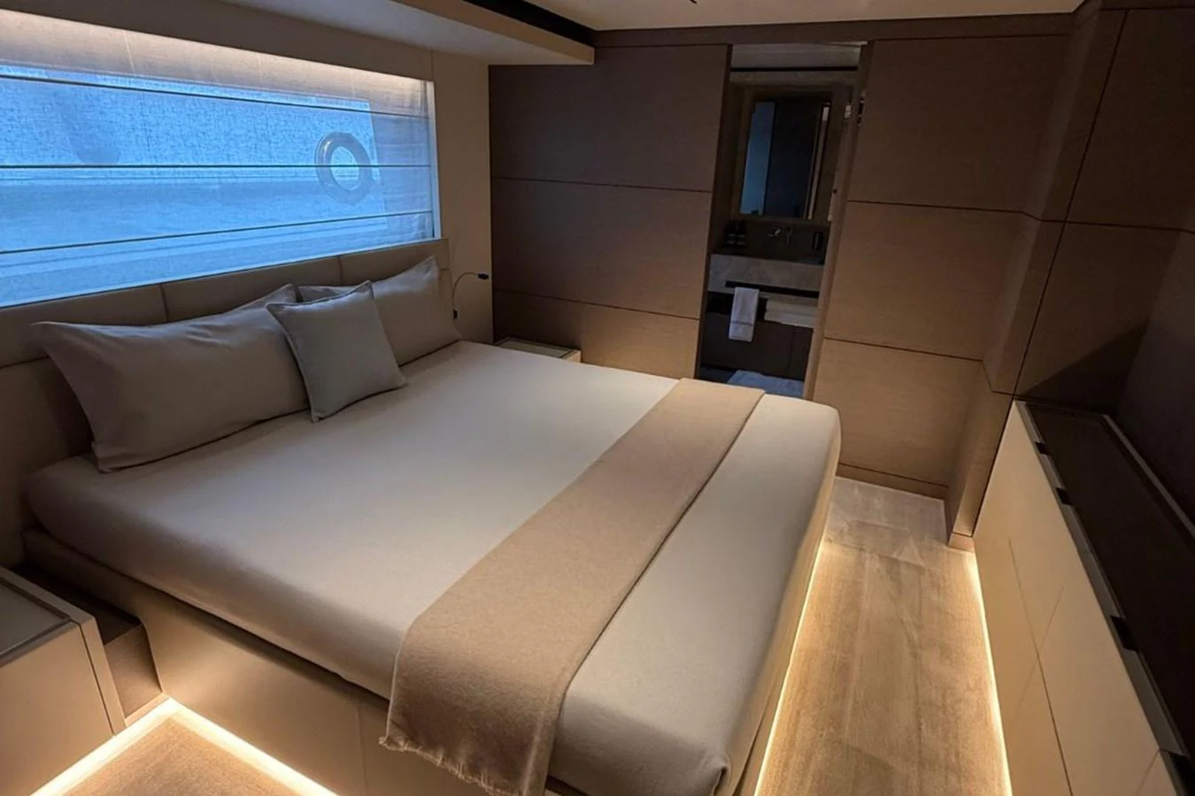 A luxurious stateroom with a large bed and modern decor. aboard ALBUS Yacht for Sale