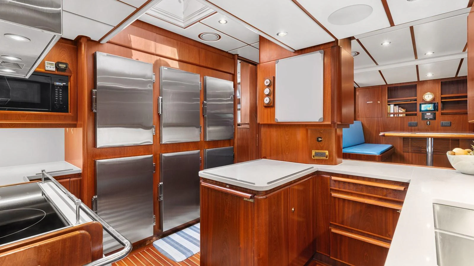 The yacht's galley features modern appliances and ample counter space, creating a functional and stylish cooking area. aboard ISLANDIA Yacht for Sale