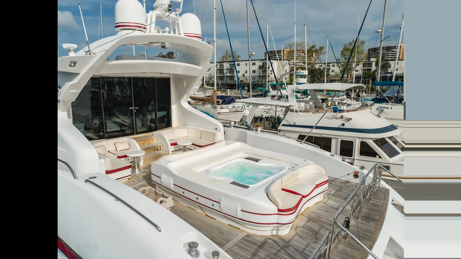 The yacht's aft deck features a luxurious hot tub surrounded by comfortable seating, perfect for relaxation. aboard SAIGON Yacht for Sale