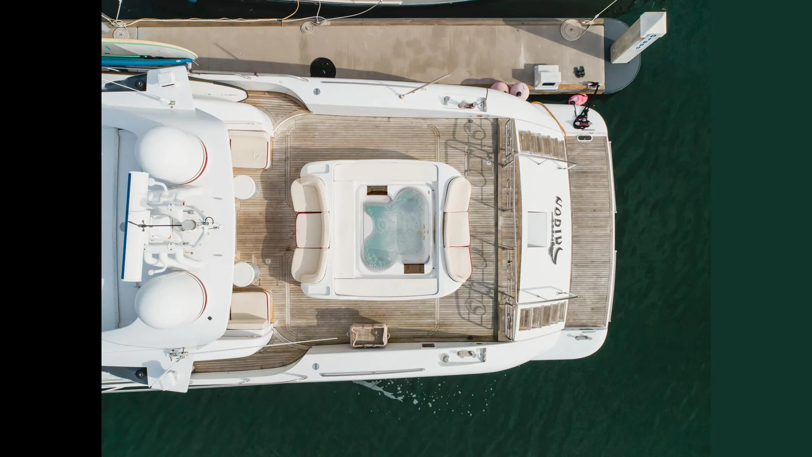 The aft deck features a spacious lounging area with a jacuzzi, perfect for relaxation. aboard SAIGON Yacht for Sale