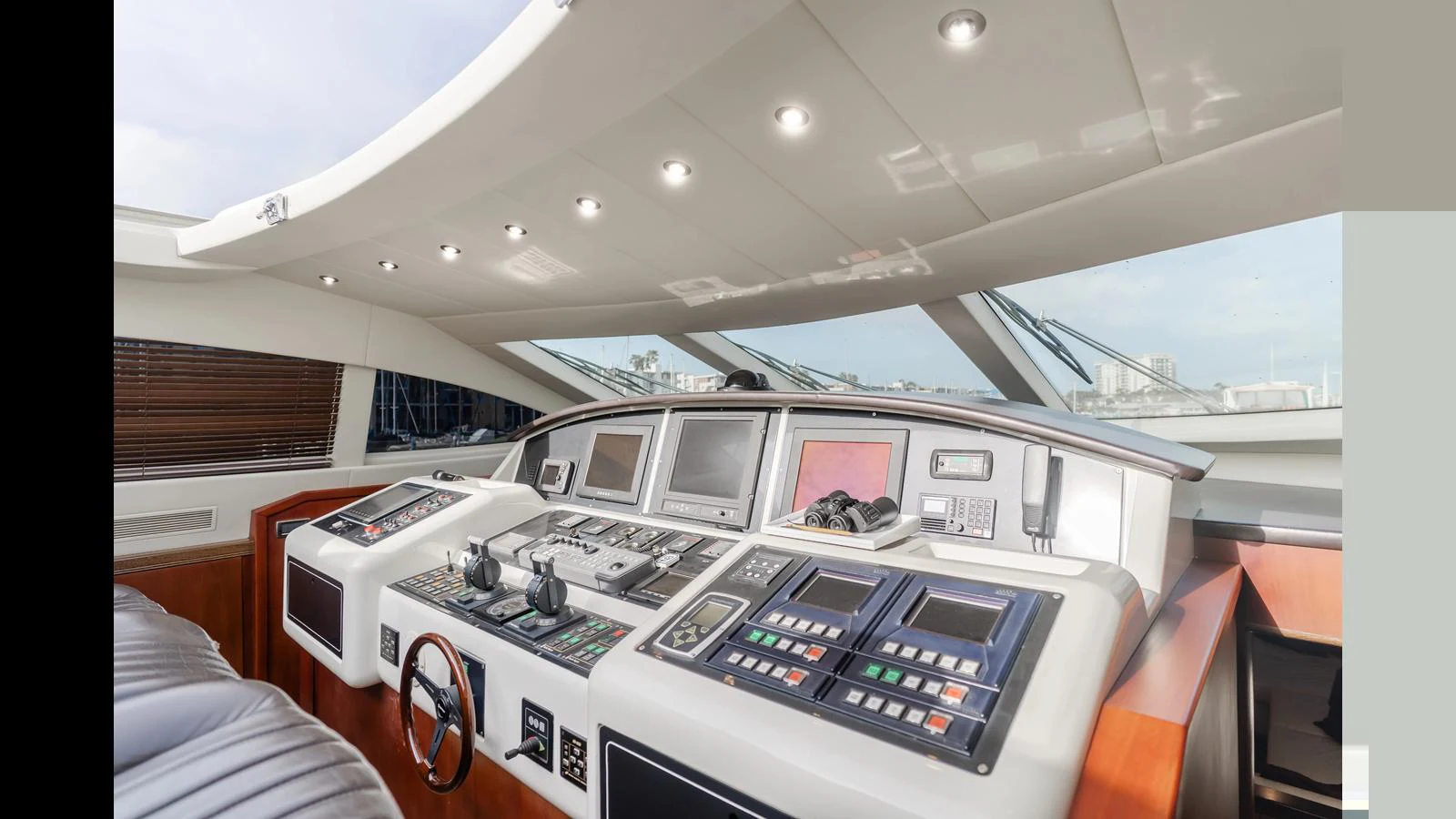 The helm station features advanced navigation and control systems in a sleek, modern design. aboard SAIGON Yacht for Sale