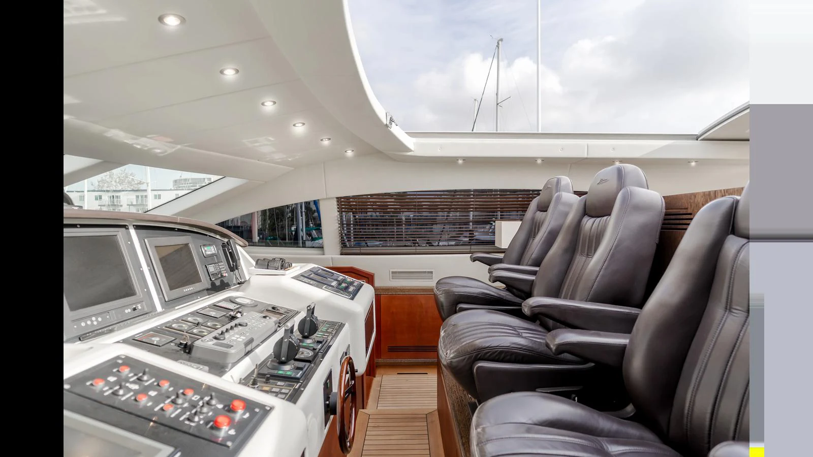 The helm station features luxurious leather seating and state-of-the-art navigation equipment. aboard SAIGON Yacht for Sale