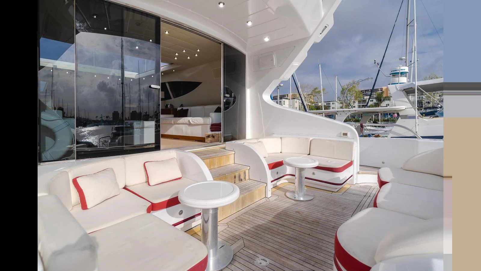 The aft deck features plush seating and tables, perfect for relaxation and socializing. aboard SAIGON Yacht for Sale
