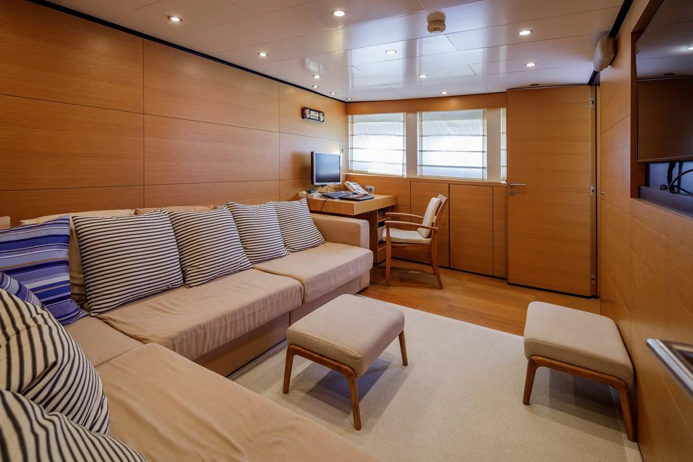 The salon features comfortable seating with a cozy and inviting atmosphere. aboard BOLARO Yacht for Sale