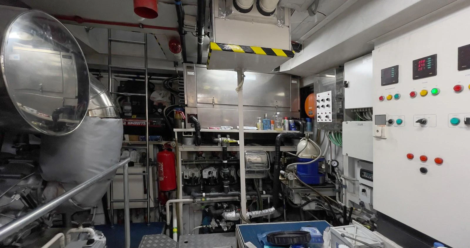 The image showcases the yacht's engine room with various machinery and control panels. aboard BOLARO Yacht for Sale