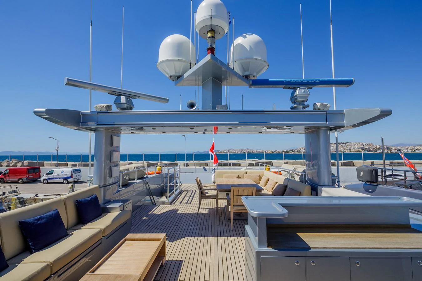 The sundeck offers ample seating and lounging areas with panoramic views. aboard BOLARO Yacht for Sale