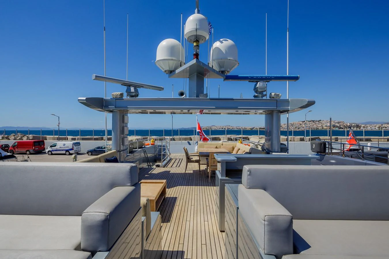 The sundeck features ample seating and dining areas with a panoramic view of the surroundings. aboard BOLARO Yacht for Sale