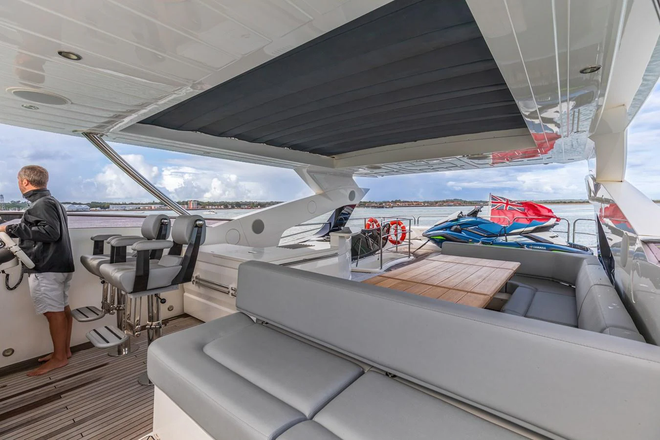The aft deck offers a spacious and comfortable area for relaxation and socializing with a view of the water. aboard CLOUDIA Yacht for Sale