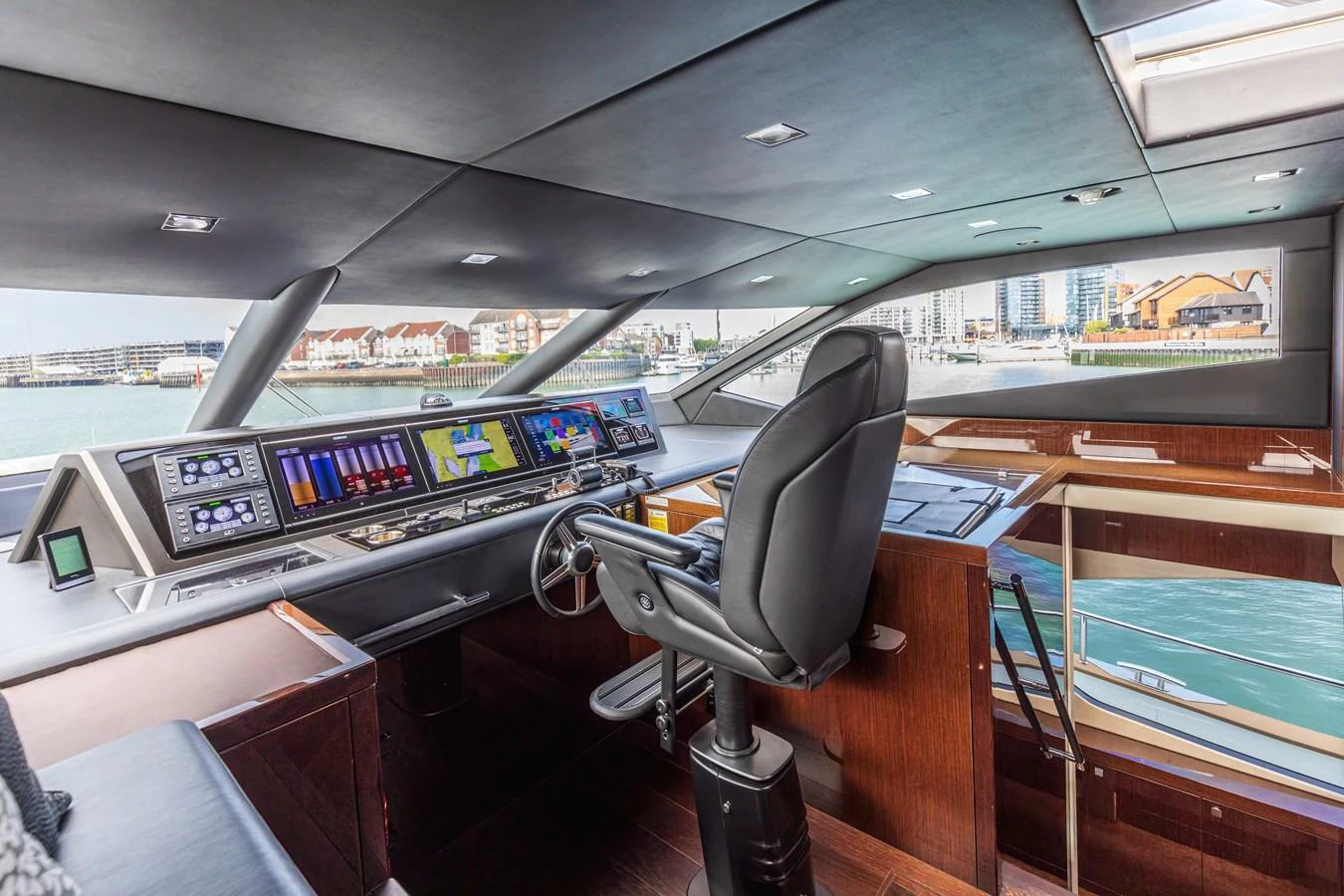 The helm station offers a sophisticated and modern control area with panoramic views. aboard CLOUDIA Yacht for Sale
