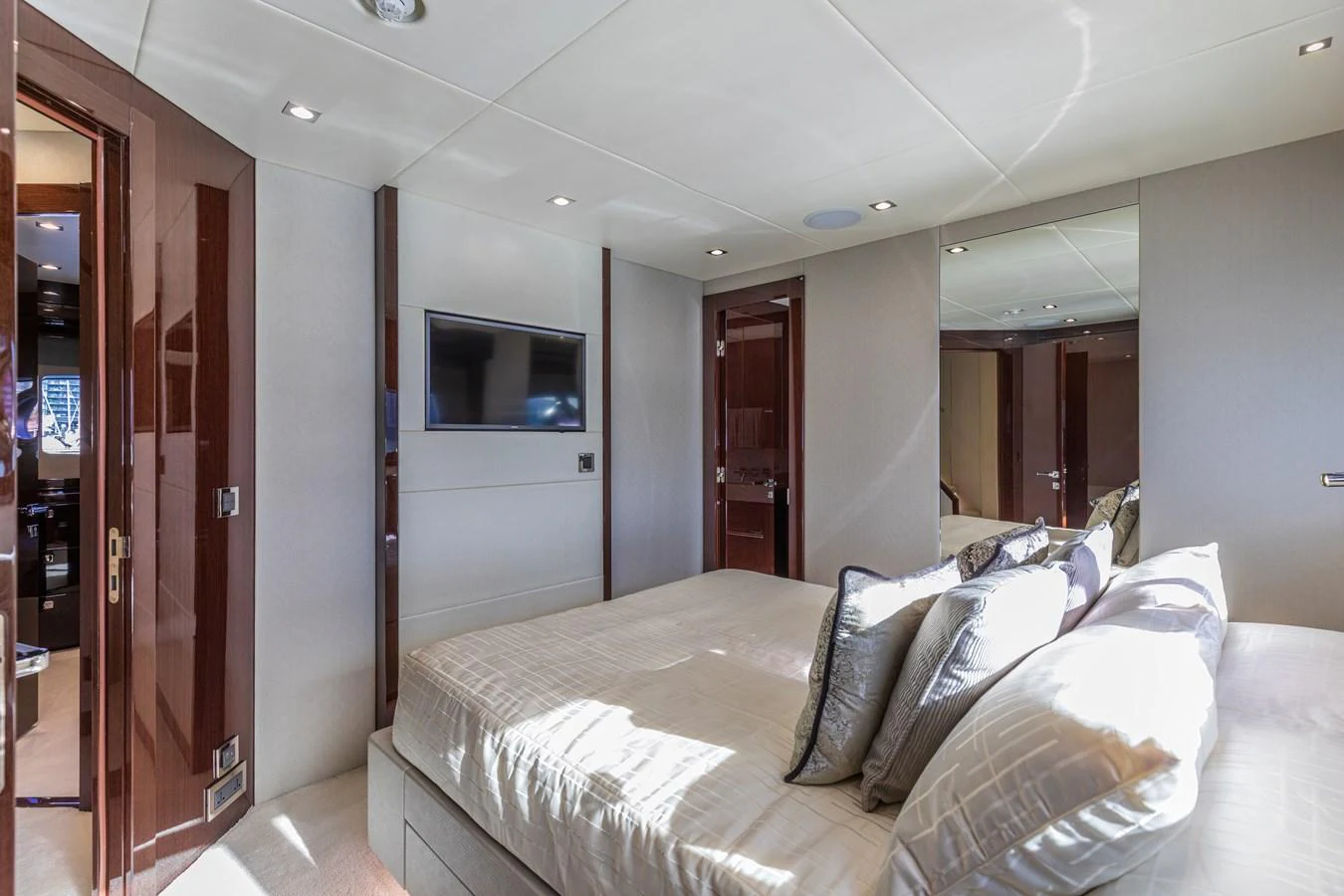 The stateroom features a luxurious bed with plush pillows and modern amenities. aboard CLOUDIA Yacht for Sale