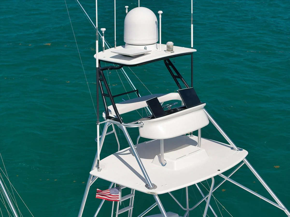 The yacht's flybridge is equipped with advanced navigation equipment and offers a commanding view of the surroundings. aboard REEL HAWK Yacht for Sale