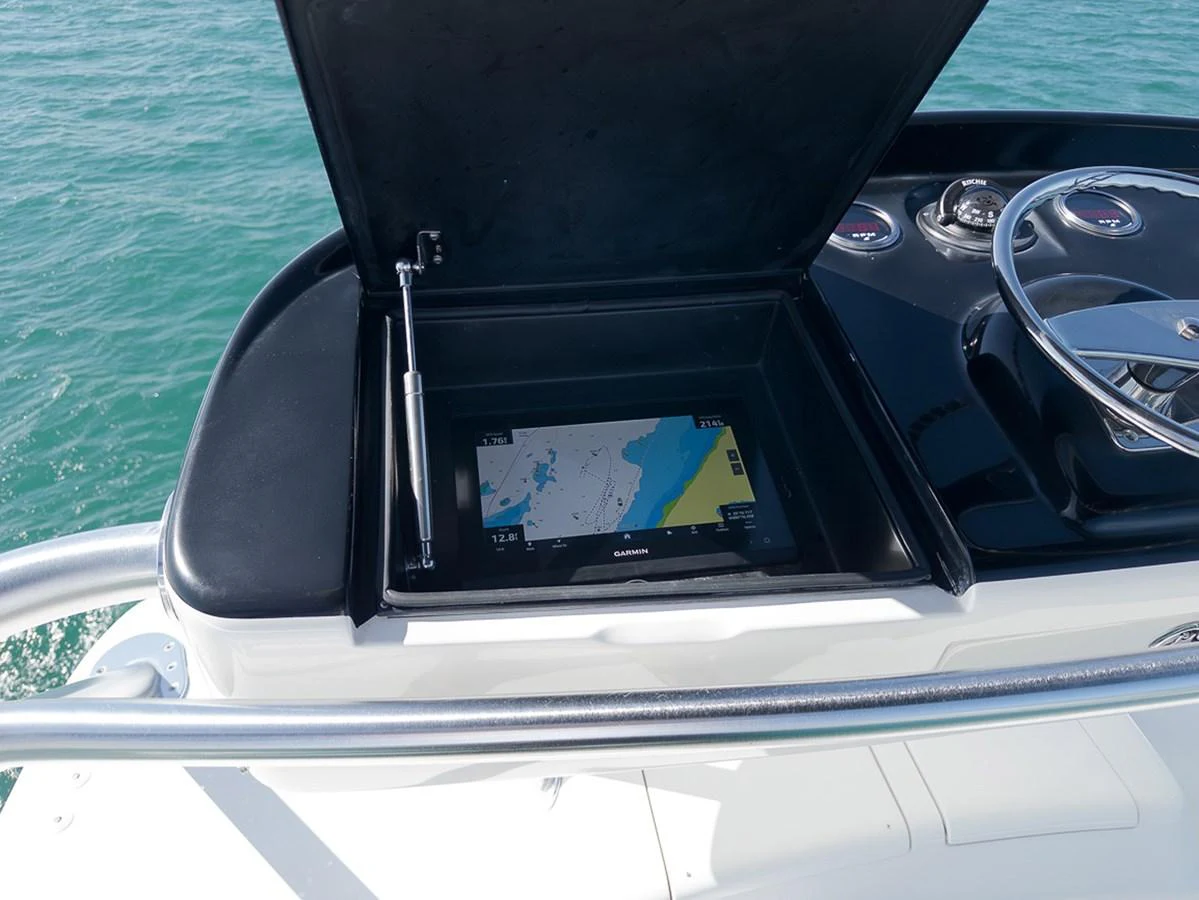 A close-up of the yacht's helm station featuring a navigation display. aboard REEL HAWK Yacht for Sale