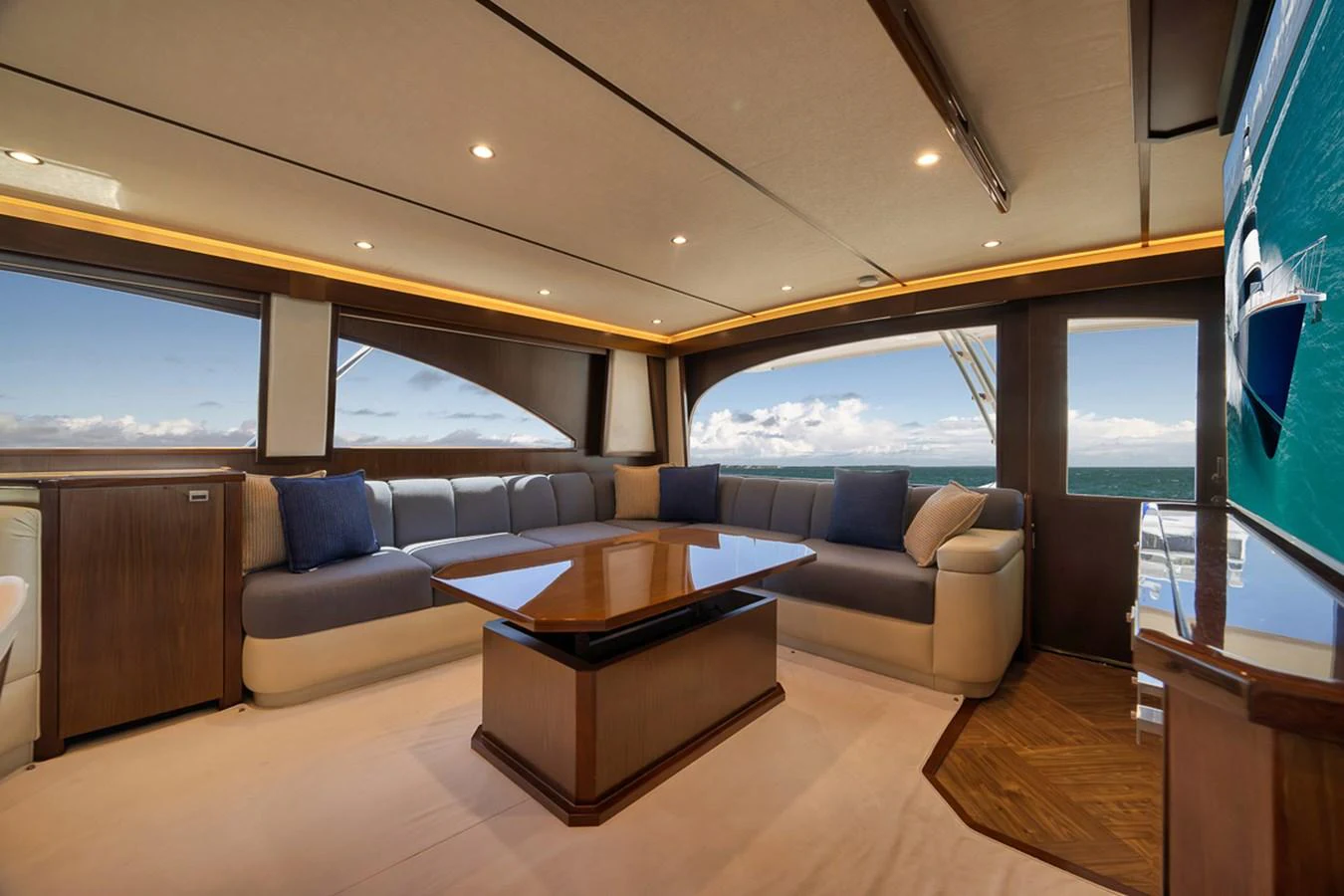 The salon offers a spacious and luxurious seating area with panoramic ocean views. aboard REEL HAWK Yacht for Sale