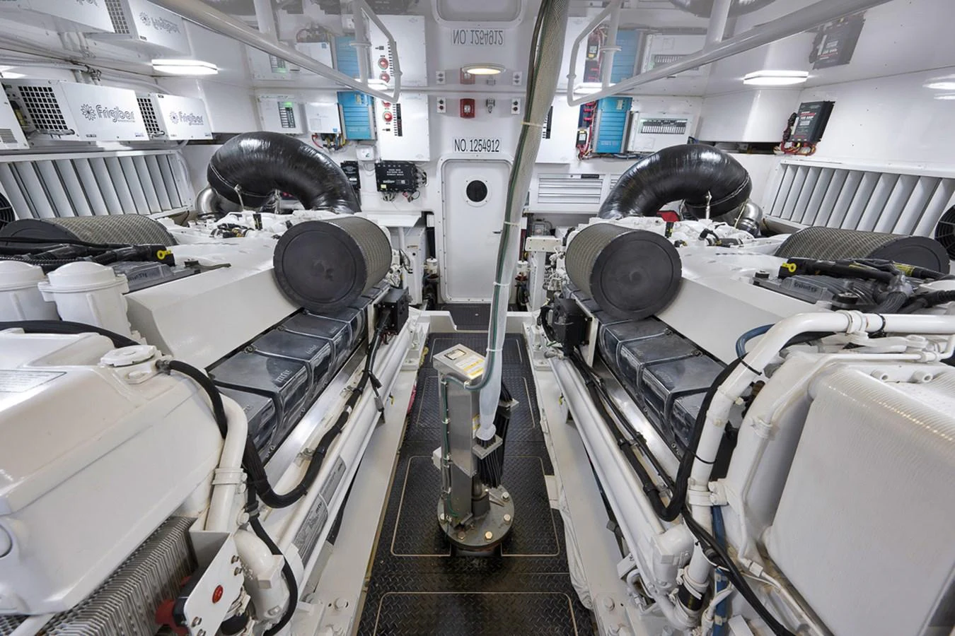 The engine room showcases powerful machinery and a well-organized layout. aboard REEL HAWK Yacht for Sale