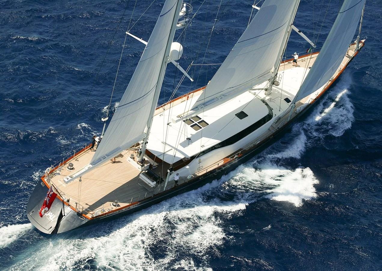 A stunning sailing yacht glides gracefully over the deep blue sea, showcasing its sleek design and impressive sails. aboard SQUALL Yacht for Sale