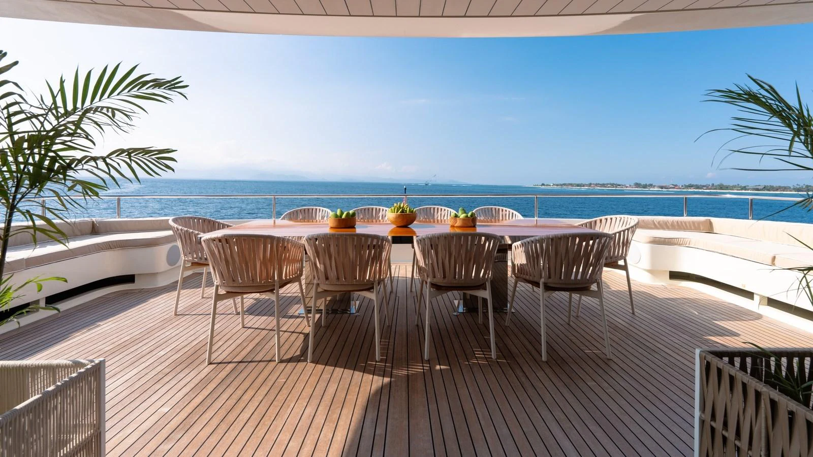 The aft deck offers a spacious and inviting outdoor dining area with stunning ocean views. aboard GALILEO Yacht for Sale
