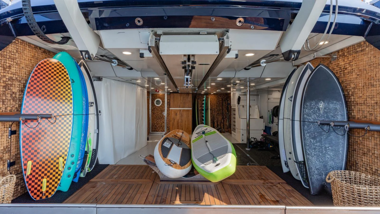 The yacht's toy garage is well-equipped with paddleboards and water sports gear, ready for adventure. aboard GALILEO Yacht for Sale