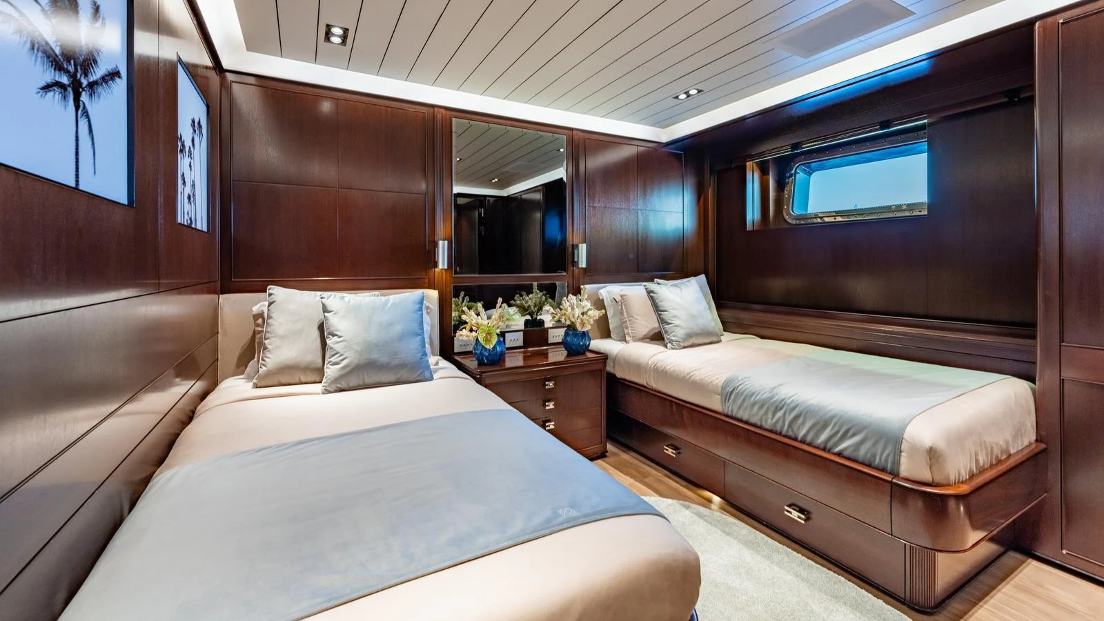 The guest stateroom features twin beds, rich wood paneling, and elegant decor. aboard GALILEO Yacht for Sale