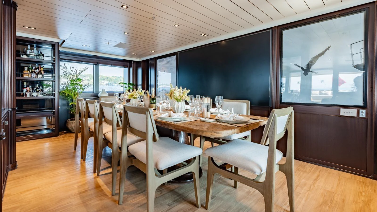 The yacht's dining area features a beautifully set table with elegant decor and ample seating. aboard GALILEO Yacht for Sale