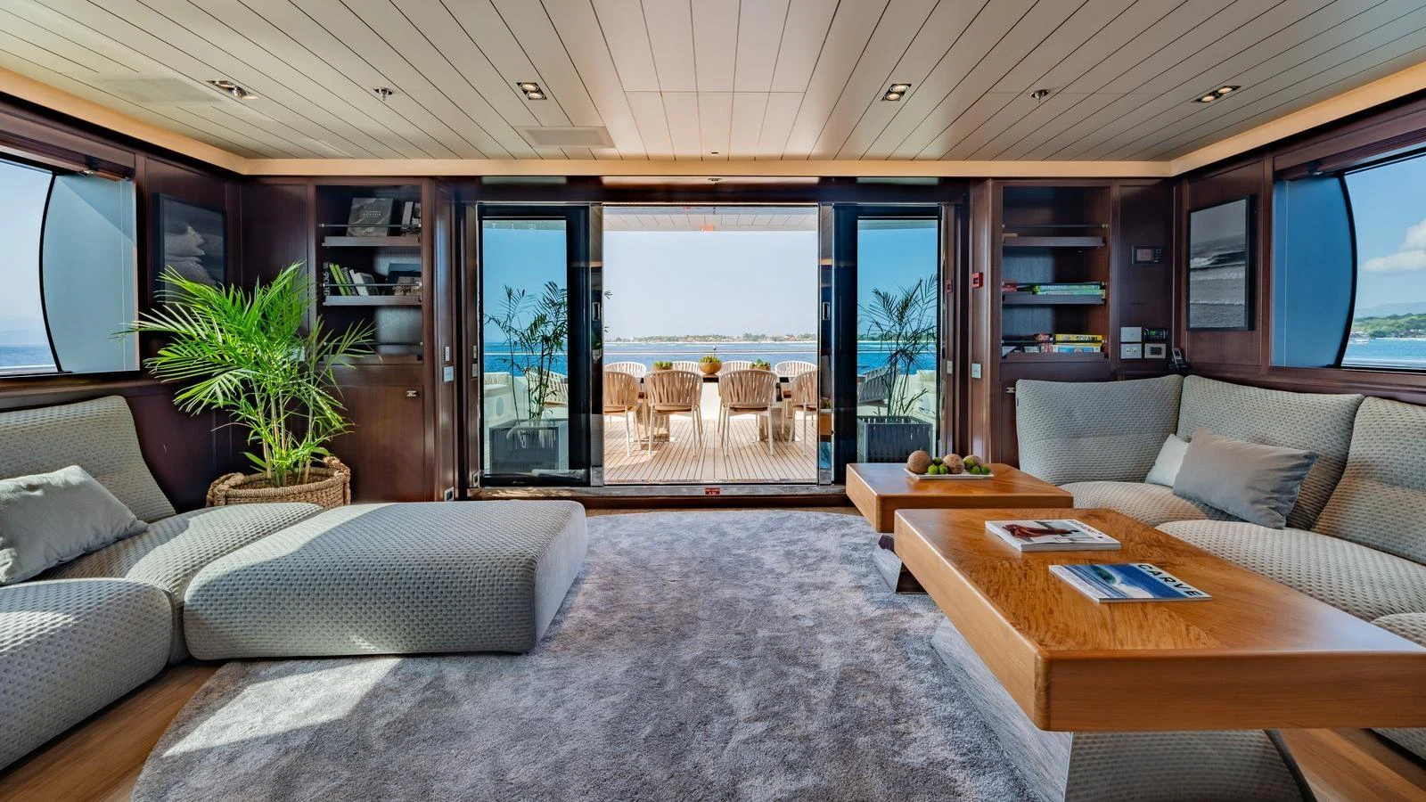 The spacious salon features plush seating and opens to a beautiful aft deck with ocean views. aboard GALILEO Yacht for Sale