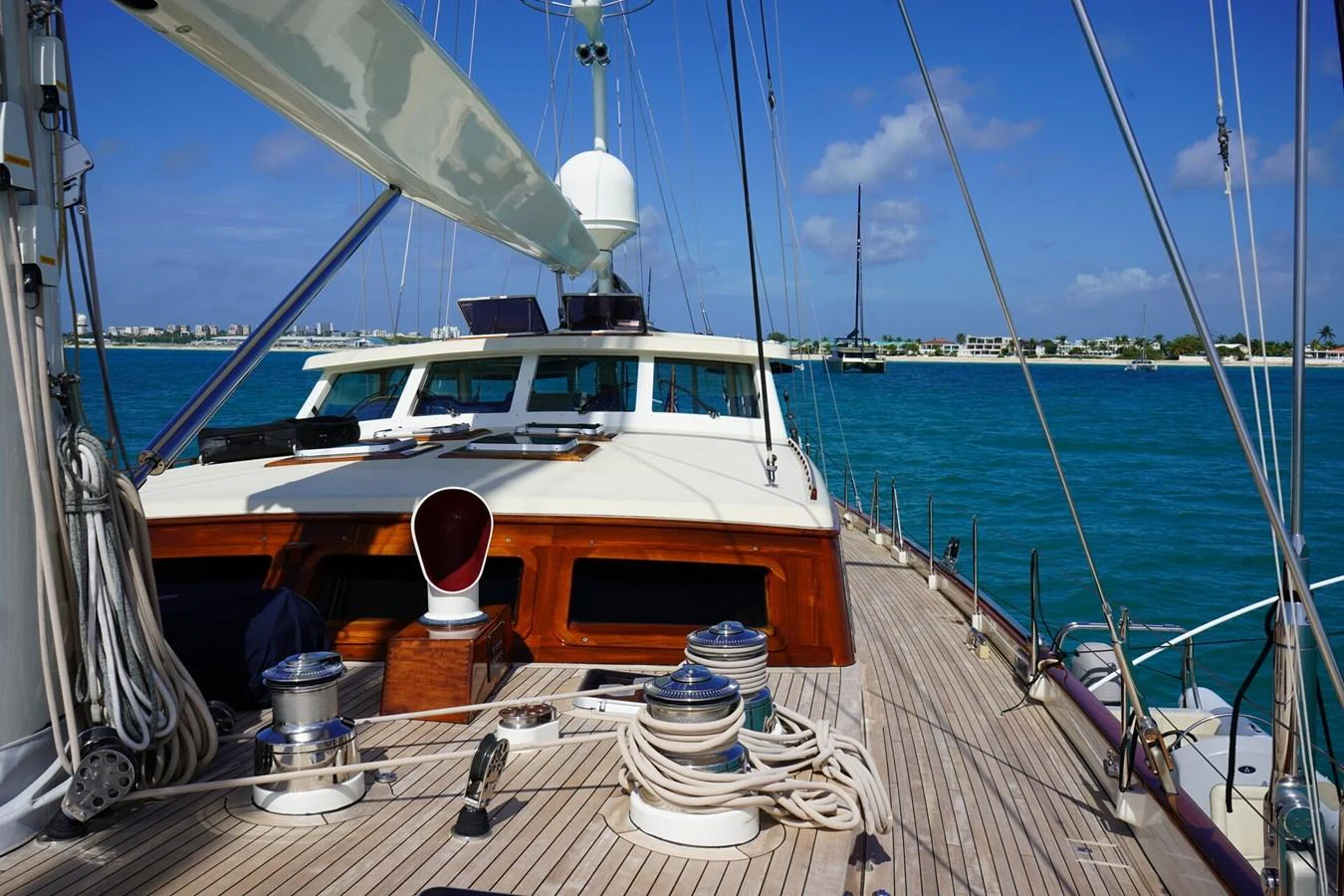 The yacht's deck offers a spacious and inviting area with a clear view of the surrounding waters. aboard KNICKERBOCKER Yacht for Sale