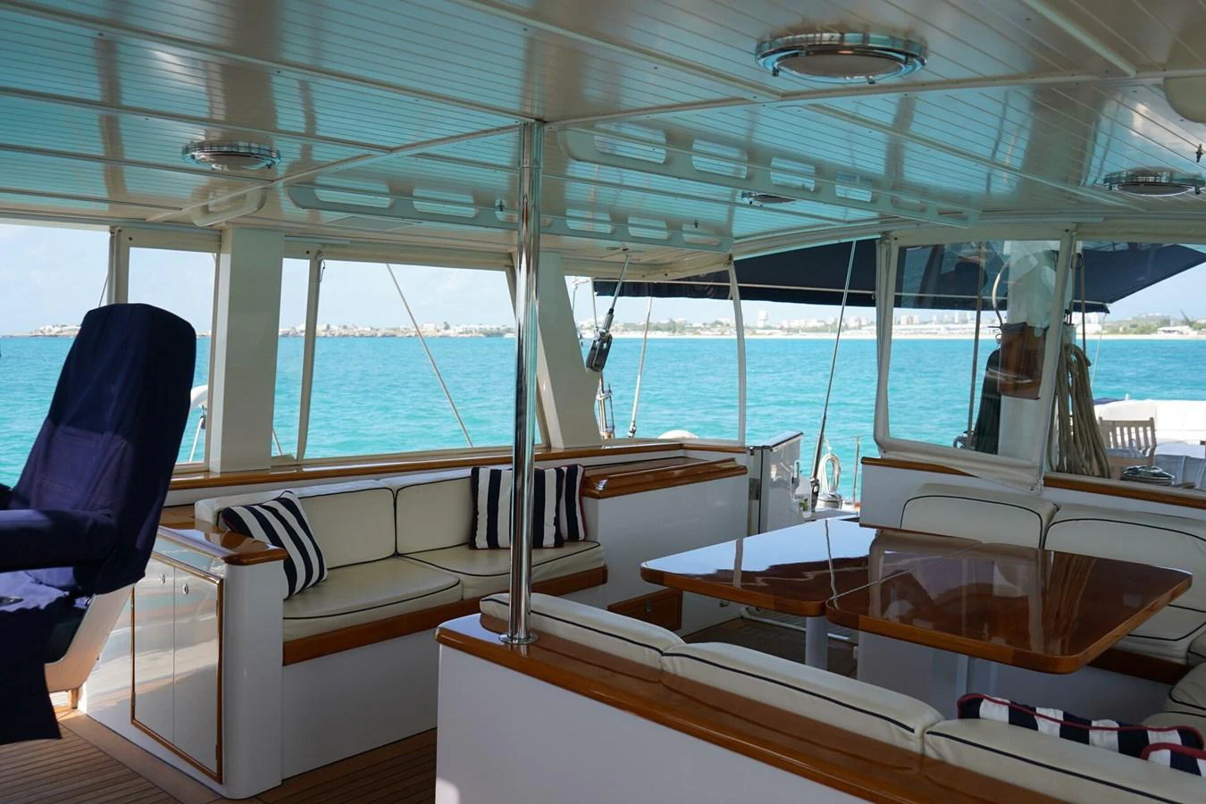 The aft deck features comfortable seating with a stunning view of the sea. aboard KNICKERBOCKER Yacht for Sale