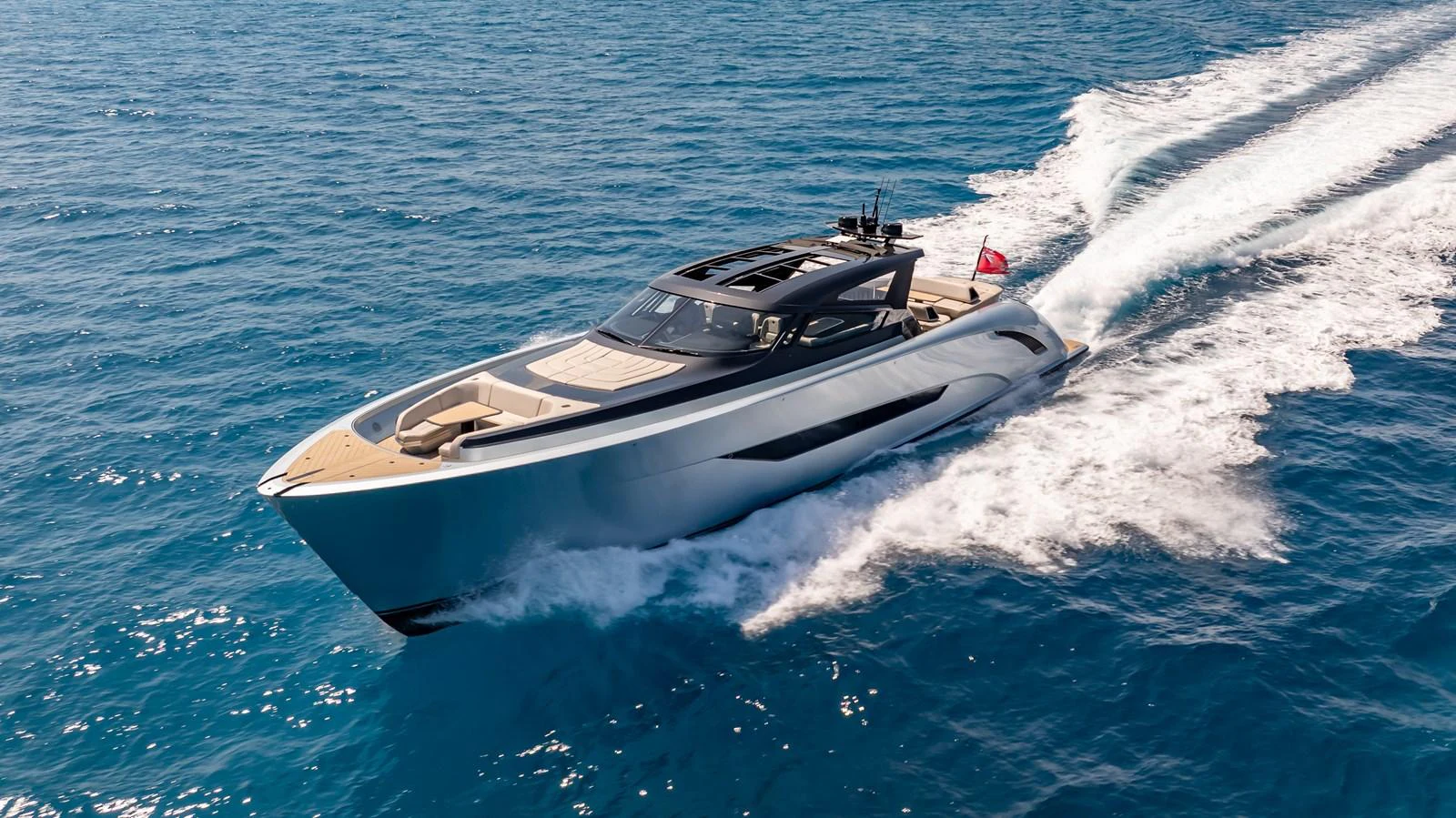 A sleek and modern yacht glides swiftly across the open sea, showcasing its elegant design and powerful performance. aboard RESOLUTE Yacht for Sale