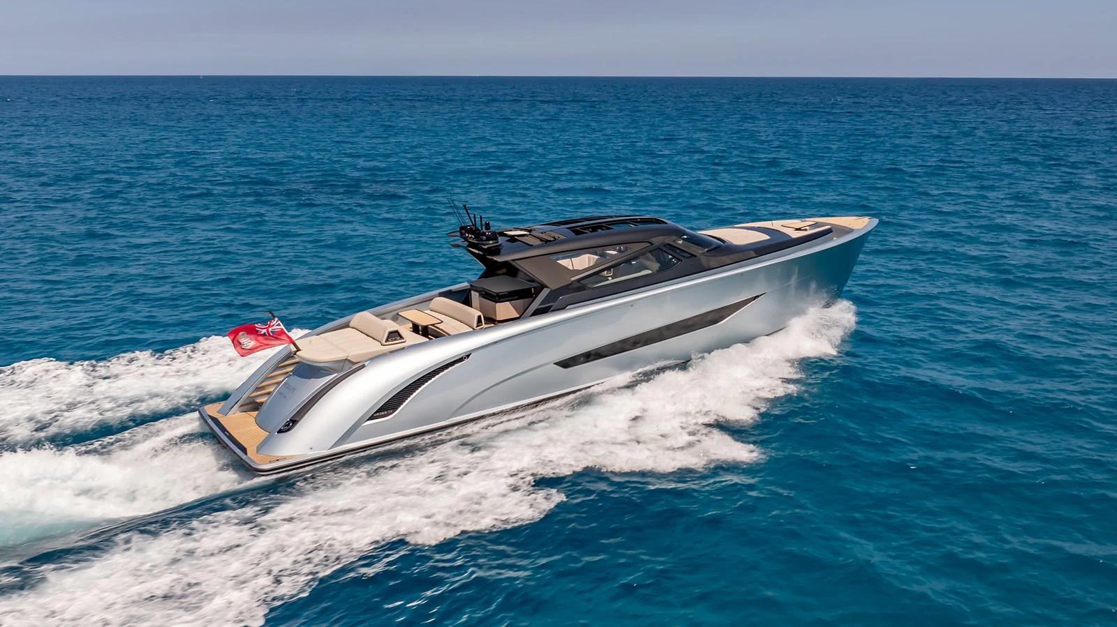 A sleek and modern yacht cruises swiftly through the open sea, showcasing its elegant design and luxurious features. aboard RESOLUTE Yacht for Sale