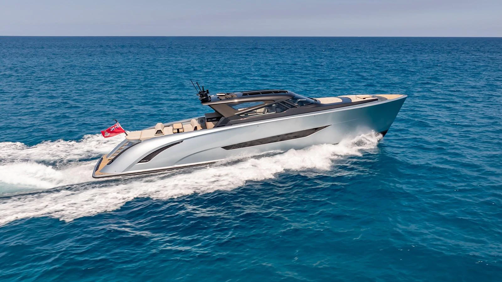 A sleek and modern yacht cruises swiftly through the open sea, showcasing its elegant design and powerful performance. aboard RESOLUTE Yacht for Sale