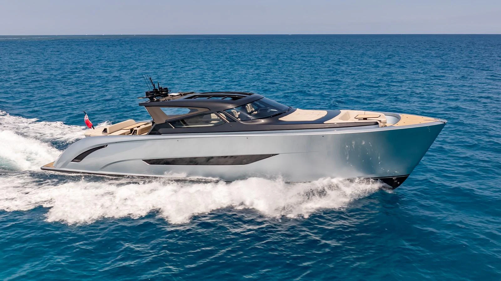 A sleek and modern yacht glides effortlessly across the open sea. aboard RESOLUTE Yacht for Sale