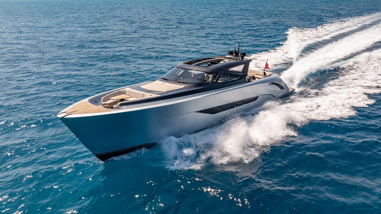 A sleek and modern yacht glides swiftly across the open sea, showcasing its elegant design and powerful performance. aboard RESOLUTE Yacht for Sale