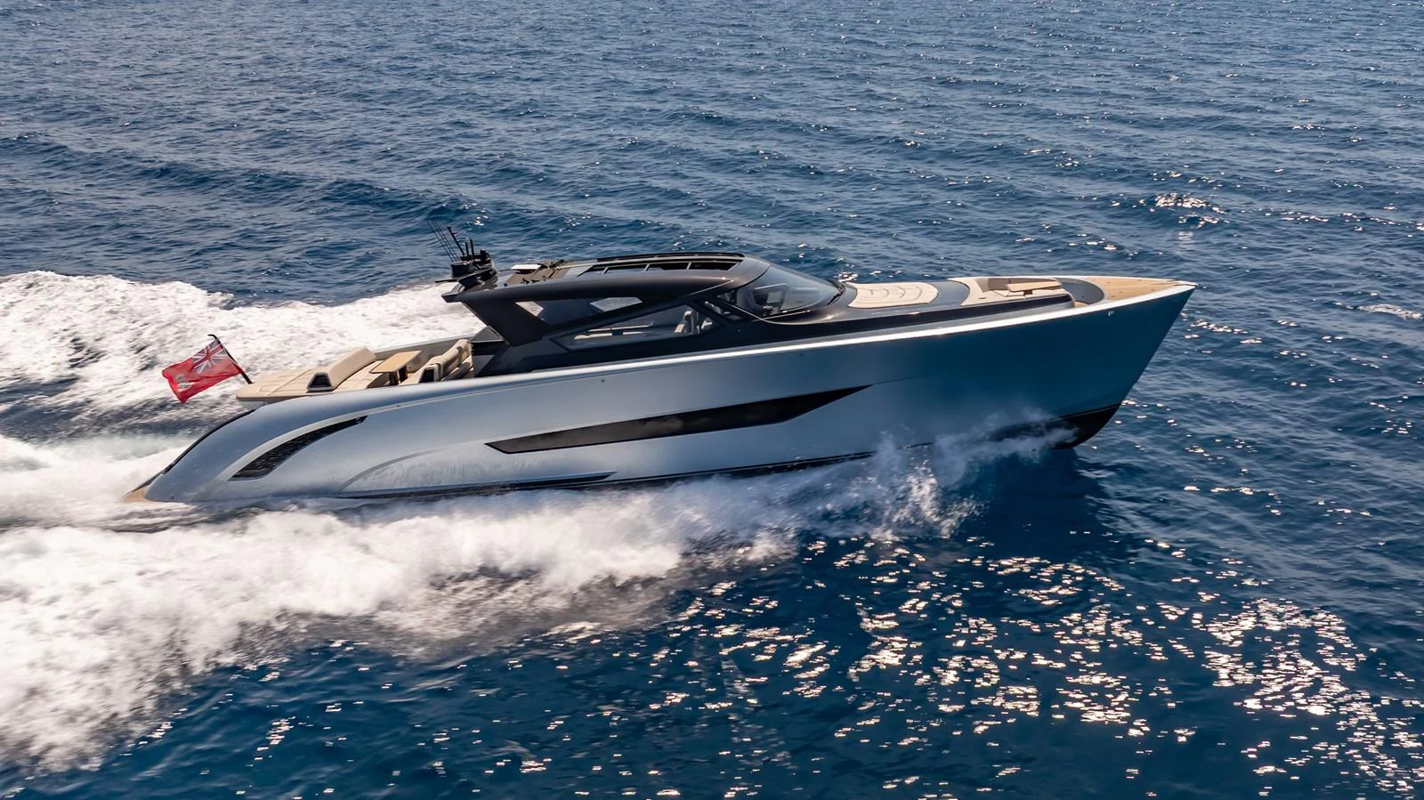 A sleek and modern yacht cruises swiftly through the open sea, showcasing its elegant design and powerful performance. aboard RESOLUTE Yacht for Sale