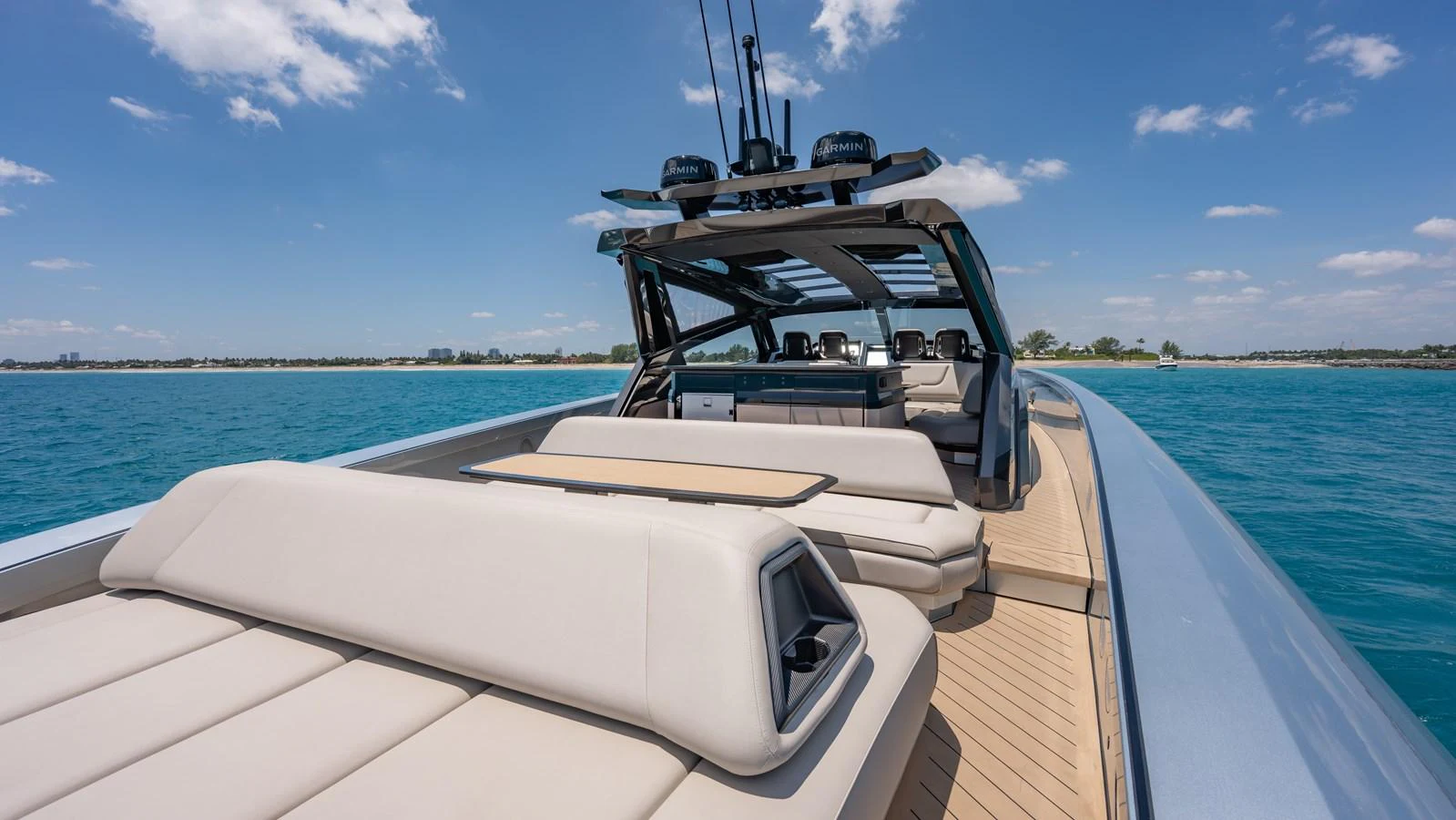 The yacht features a spacious aft deck with luxurious sun loungers and a sleek, modern design. aboard RESOLUTE Yacht for Sale
