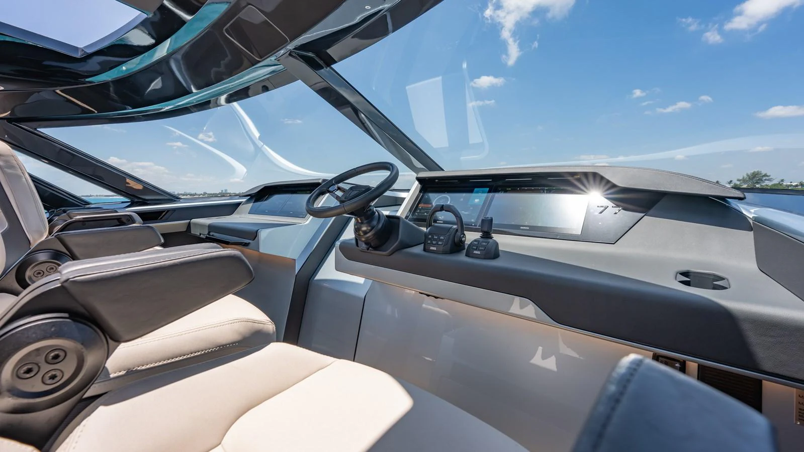 The helm station features sleek, modern controls and panoramic views for an exceptional navigation experience. aboard RESOLUTE Yacht for Sale