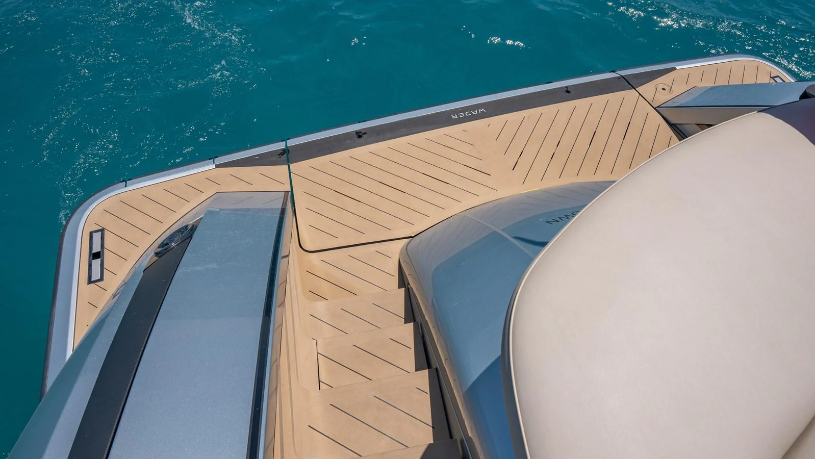 The image showcases the sleek and modern design of the yacht's swim platform with elegant teak decking. aboard RESOLUTE Yacht for Sale