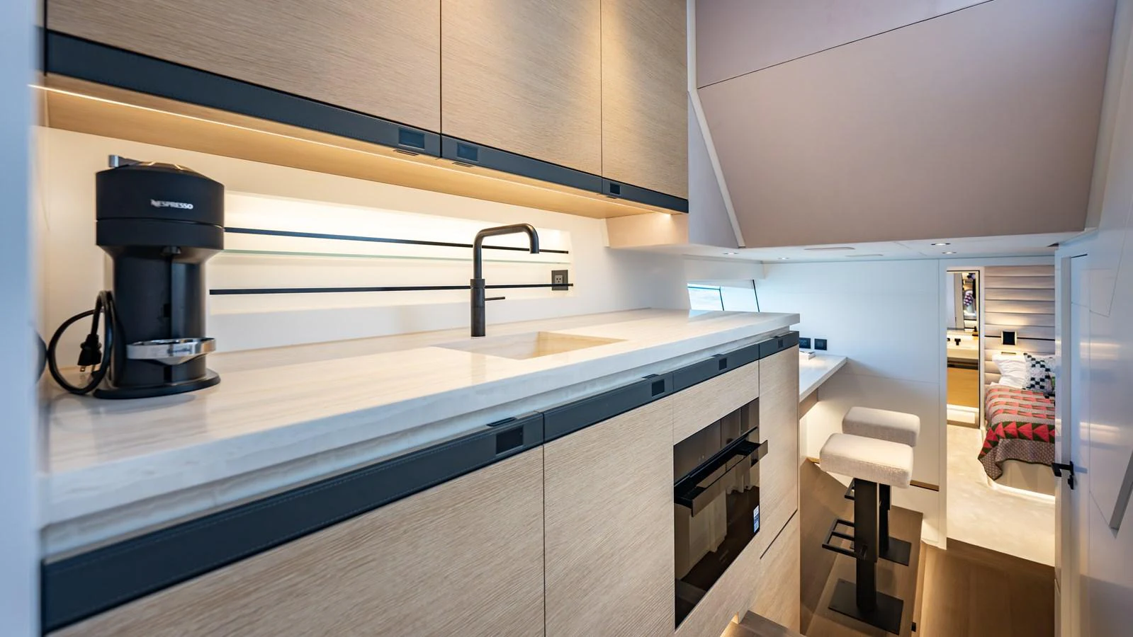 The galley features modern appliances and sleek cabinetry, providing a stylish and functional space for meal preparation. aboard RESOLUTE Yacht for Sale