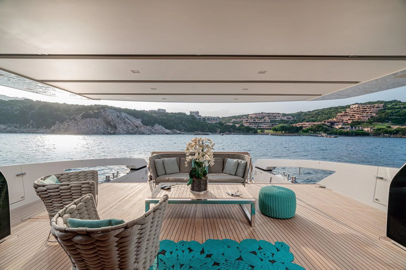 The aft deck offers a serene and stylish space with comfortable seating and stunning views of the surrounding waters. aboard M&M Yacht for Sale