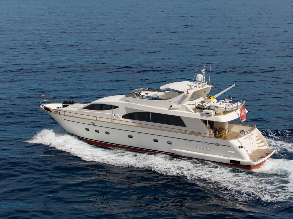 A sleek and elegant yacht cruising on the open sea, showcasing its luxurious design and spacious deck areas. aboard LADY MAUREEN Yacht for Sale