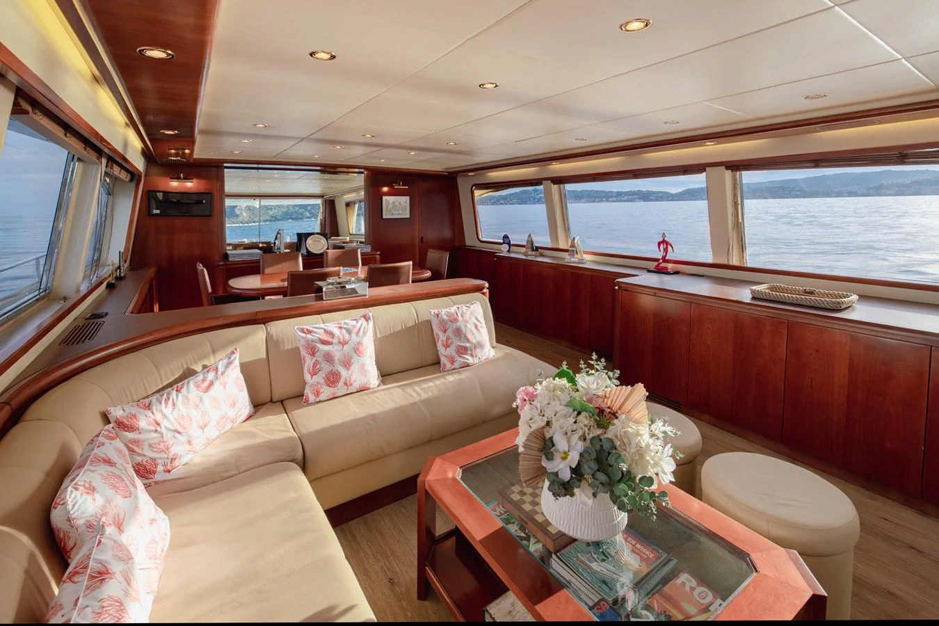 The yacht's salon offers a spacious and inviting area with panoramic windows and elegant furnishings. aboard LADY MAUREEN Yacht for Sale