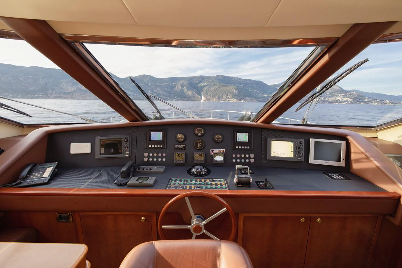 The helm station offers a commanding view with state-of-the-art navigation equipment. aboard LADY MAUREEN Yacht for Sale