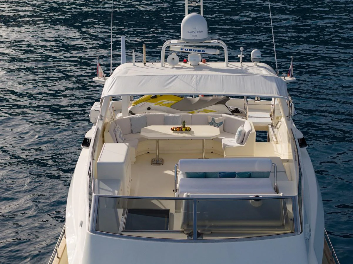 The yacht's flybridge offers a spacious and inviting area for relaxation and entertainment. aboard LADY MAUREEN Yacht for Sale