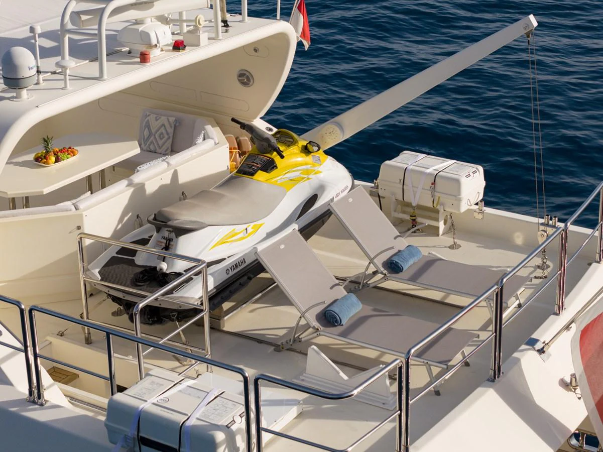 The aft deck features a jet ski and sun loungers, perfect for relaxation and water activities. aboard LADY MAUREEN Yacht for Sale